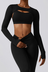Black athletic sosala outfit with long sleeves add on top and cut-out design on a gray background
