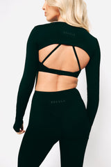 Model wearing sosala bralet, sleeves top and leggings, athleisure set