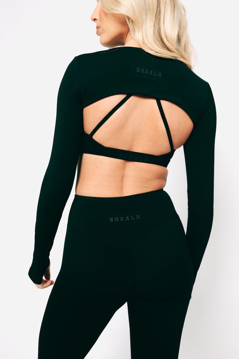 Model wearing sosala bralet, sleeves top and leggings, athleisure set